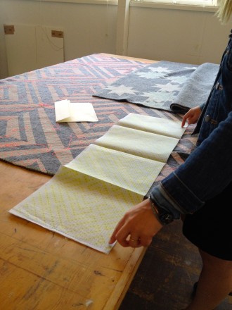 Laura maps out her weaving pattern on paper