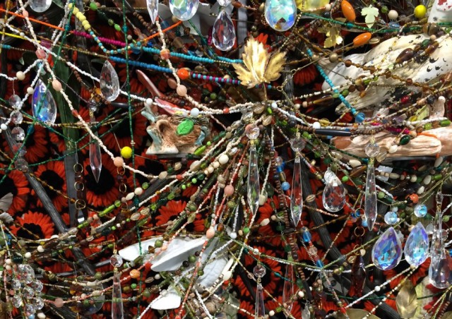 Nick Cave, detail of the large-scale wall based bas reliefs dripping with crystals, beads and metal flowers.