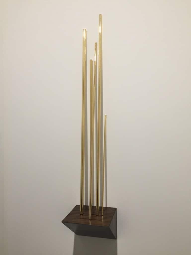 Jorge Méndez Blake "Why I'm not a Painter (Frank O'hara)" 2015 gold plated copper tubes, wood. Courtesy of Meessen De Clerq